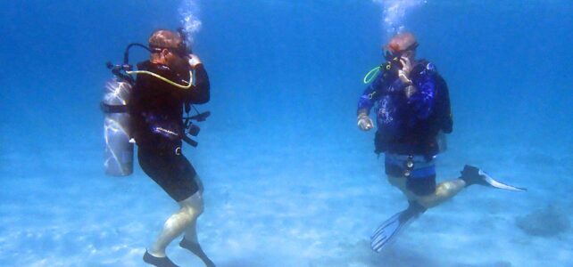 Student diver and instructor in the ocean